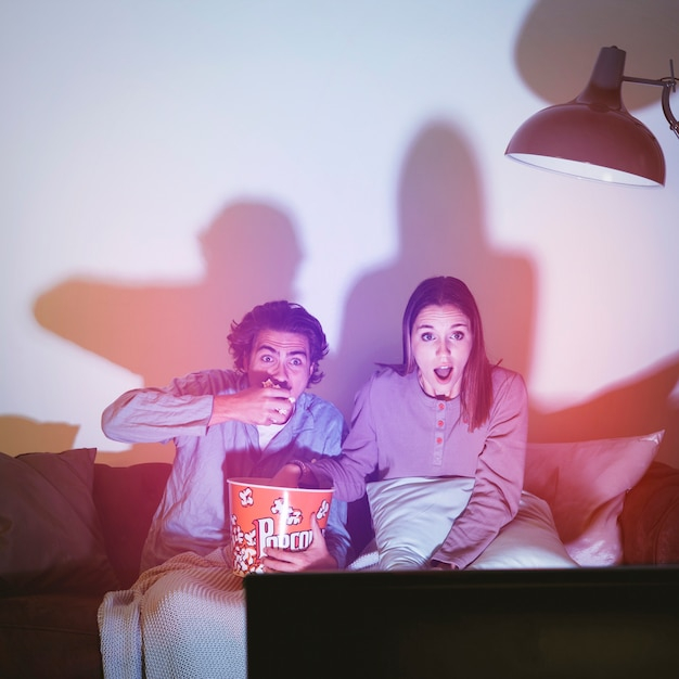 Couple watching a horror movie