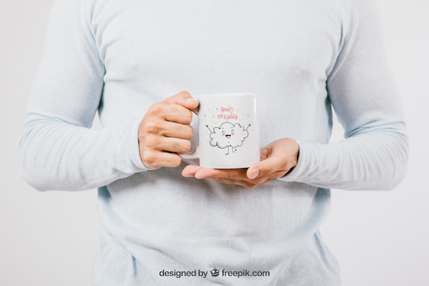 Mock up design with hands holding a coffee mug