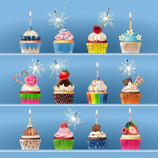 Collection of festive cupcakes with sparklers and candles.