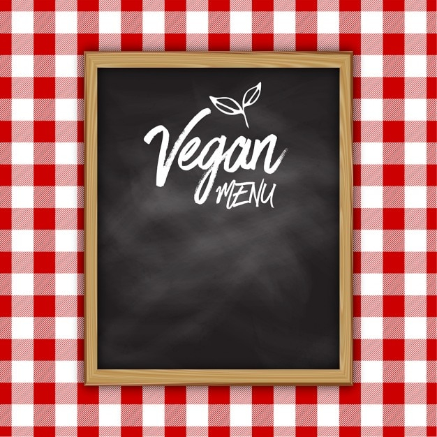 Vegan menu chalkboard on a tablecloth background