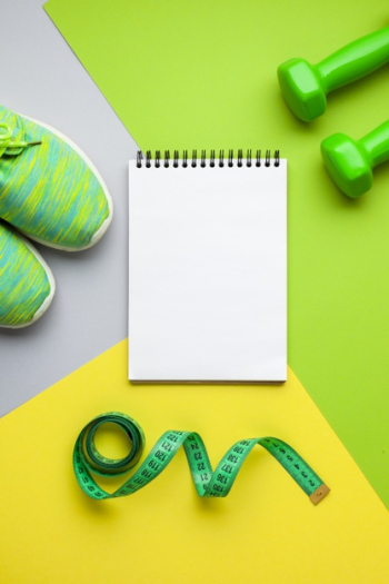 Top view sports equipment and notebook mock-up Free Photo