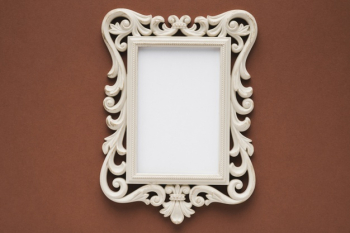 Flat lay elegant frame with brown background Free Photo