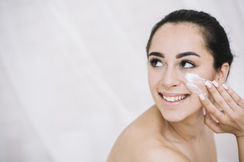 Woman with a facial treatment Free Photo