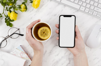 Top view smartphone template over workspace Free Photo