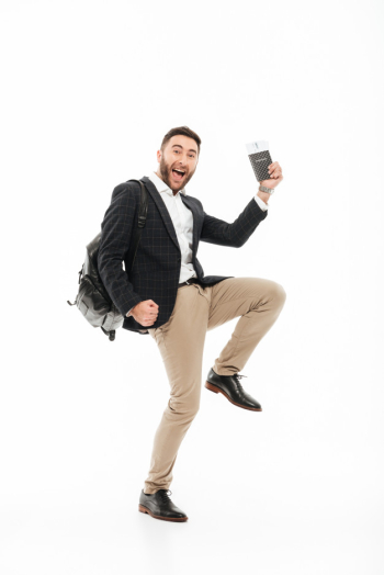 Full length portrait of a joyful excited man holding passport Free Photo