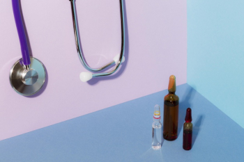 Arrangement with stethoscope and vials Free Photo