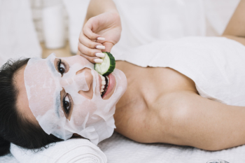 Woman with a cucumber mask Free Photo