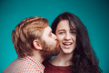 Young man and woman kissing Free Photo