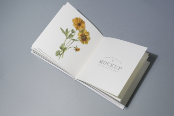 Mid fold book mockup with floral illustration Free Psd