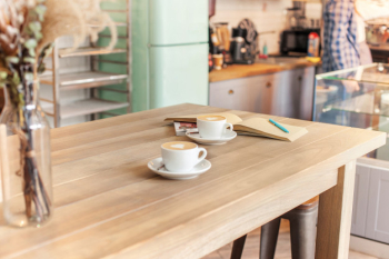 A table setting for coffee on the counter at a coffee house Free Photo