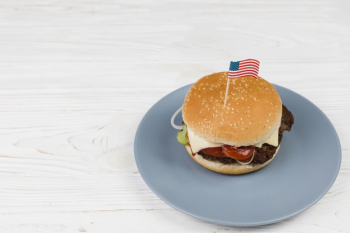 Hamburger on plate with flag Free Photo