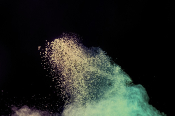 Flying powder particles in air Free Photo