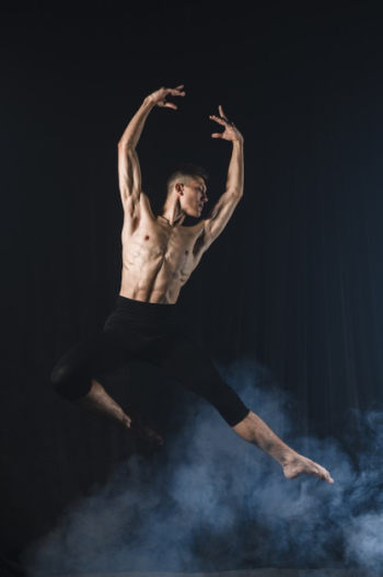 Ballerino posing in mid-air with tights Free Photo