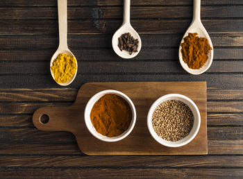 Various spices near cutting board