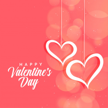 Hanging hearts on pink bokeh background for valentines day