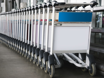 Luggage trolley at the airport with sign mockup Free Psd