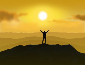  Victorious - Man standing on the top of a mountain raising 