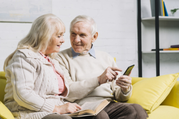 Senior couple using smartphone