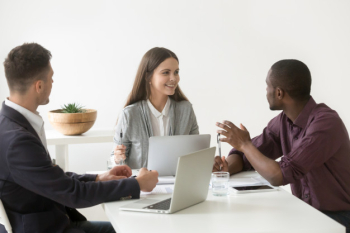Creative millennial multiracial business team having discussion at office meeting