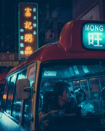 people riding bus during nighttime