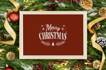 Merry christmas greeting in a frame mockup Free Psd