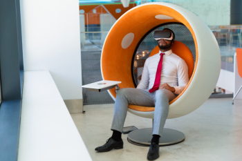 Peaceful businessman in vr headset enjoying virtual video Free Photo