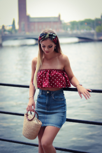Woman Wearing Red and White Crop Top Beside the Body of Water