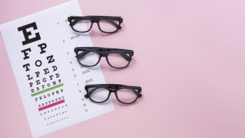 Alphabet table with glasses on pink background Free Photo