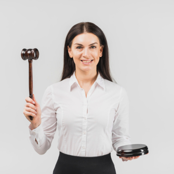 Woman lawyer standing with gavel and smiling