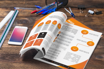 Magazine and smartphone mockup on wooden table with pens and rulers Free Psd