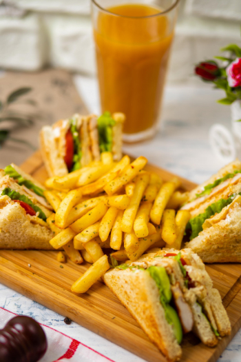 Club sandwich served with french fries and soft drink, mayonnaise, ketchup Free Photo