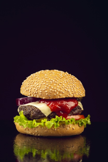 Front view burger with black background Free Photo