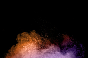 Flying colorful powder in swirls Free Photo