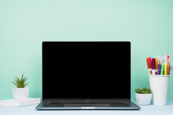 Simplistic front view laptop on desk Free Photo