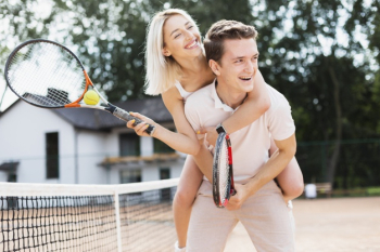 Active young couple playing tennis Free Photo