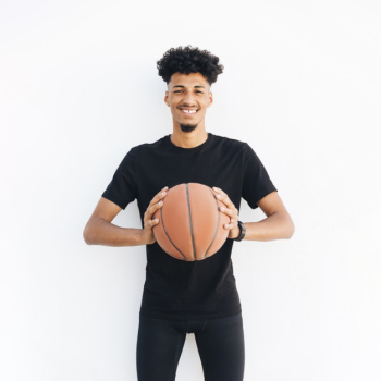 Young black man with basketball looking at camera Free Photo