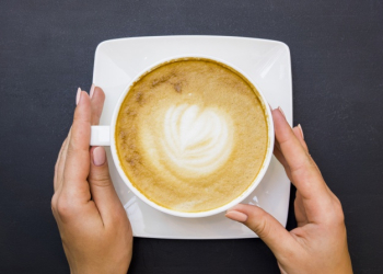 Top view hands holding cup of coffee Free Photo