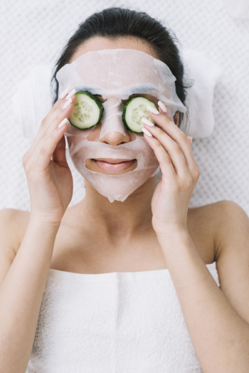 Woman with a cucumber mask Free Photo
