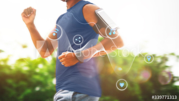 Man exercising outdoors with a smart devices