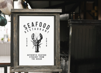 Rustic style sign mockup at a seafood restaurant Free Psd