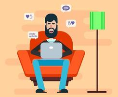 Bearded man sitting in a chair with a laptop Free Vector