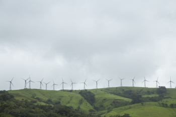Row of windmill on green mountain top at costa rica Free Photo