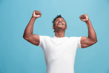 Winning success afro-american man happy ecstatic celebrating being a winner. dynamic energetic image of male model Free Photo