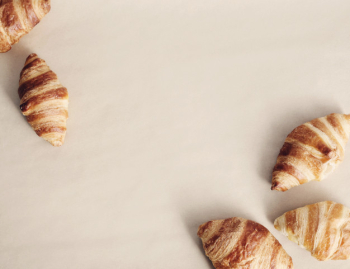 Croissants on beige background, copyspace top view Free Photo