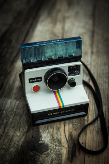 Photo Of Polaroid On Wooden Surface