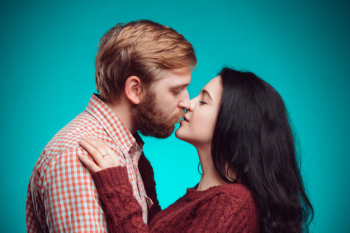 Young man and woman kissing Free Photo