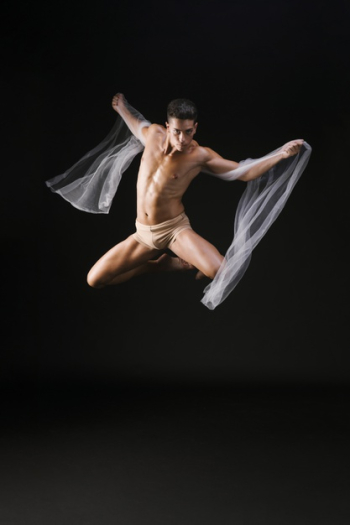 Male gymnast jumping in air Free Photo
