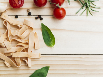 Flat lay composition of pasta with copyspace Free Photo