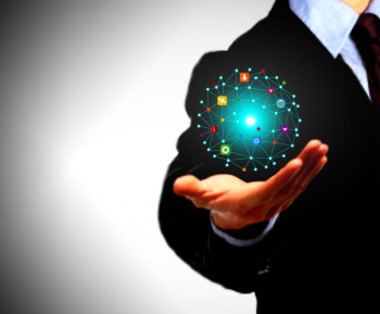 Businessman holding a globe with information technology icons
