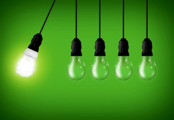 Eco Concept - Energy Saver Lightbulb Among Common Lightbulbs